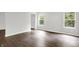 Well-lit living room with hardwood floors and generous light, ideal for relaxation and entertaining at 11437 High Grass Dr, Indianapolis, IN 46235