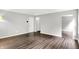 Expansive living area with hardwood floors, offering a versatile space for living and entertaining at 11437 High Grass Dr, Indianapolis, IN 46235