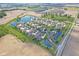 Aerial view of the community, showcasing ponds, landscaping, and well-maintained homes in a serene setting at 1146 Distinctive Way, Greenfield, IN 46140