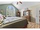 Bedroom showcasing a large window and hardwood floors, creating a bright and airy space at 1146 Distinctive Way, Greenfield, IN 46140