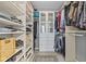 Spacious walk-in closet with built-in shelving and drawers provides ample storage space at 1146 Distinctive Way, Greenfield, IN 46140