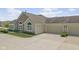 Attached three car garage and lush landscaping at 1146 Distinctive Way, Greenfield, IN 46140