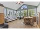 Bright sunroom filled with lots of natural light and comfortable seating at 1146 Distinctive Way, Greenfield, IN 46140