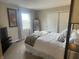 Tranquil bedroom featuring a comfortable bed, soft lighting, and mirrored closet doors at 11621 Coastal Dr, Indianapolis, IN 46229