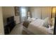 Bright bedroom features soft carpet, a large window, and plenty of closet space at 11621 Coastal Dr, Indianapolis, IN 46229