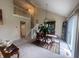 Bright dining area with classic wood furniture, overhead lighting, staircase view and sliding glass door at 11621 Coastal Dr, Indianapolis, IN 46229