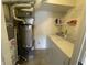 Functional laundry room with a newer washer and dryer, shelving, and ample storage at 11621 Coastal Dr, Indianapolis, IN 46229