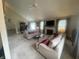 Expansive living room with high ceilings, fireplace, plush carpeting, and an adjacent dining area at 11621 Coastal Dr, Indianapolis, IN 46229