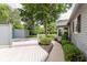 Backyard featuring a deck, lush landscaping and a walkway at 12112 Roxbury Pl, Carmel, IN 46033