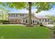 Large backyard featuring a tree, lush lawn and a deck at 12112 Roxbury Pl, Carmel, IN 46033