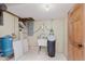 Utility area in basement featuring a sink, water softener and door at 12112 Roxbury Pl, Carmel, IN 46033