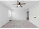 Bedroom with plush carpet, a ceiling fan, and a window that provides natural light at 12112 Roxbury Pl, Carmel, IN 46033