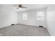 Well-lit bedroom with plush carpet, ceiling fan, and a window with white blinds at 12112 Roxbury Pl, Carmel, IN 46033