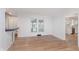Bright dining room area with hardwood floors and a view into the kitchen at 12112 Roxbury Pl, Carmel, IN 46033