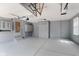 Spacious garage with ample storage cabinets and painted floors at 12112 Roxbury Pl, Carmel, IN 46033