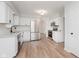 Stylish kitchen featuring white cabinets, stainless steel appliances, and modern countertops at 12112 Roxbury Pl, Carmel, IN 46033
