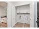 Functional laundry room with storage and access to the wet bar at 12112 Roxbury Pl, Carmel, IN 46033