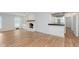 Large living room with fireplace, hardwood floors, and a wet bar for entertaining guests at 12112 Roxbury Pl, Carmel, IN 46033