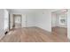 Bright living room features wood-look floors and abundant natural light at 12112 Roxbury Pl, Carmel, IN 46033