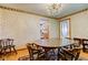 A view of the dining room from an angle that shows the door to the kitchen at 132 S First St, Jamestown, IN 46147