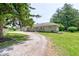 Charming one-story home with stone facade, two-car garage, and well-manicured lawn at 132 S First St, Jamestown, IN 46147