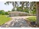 Charming one-story home with stone facade, two-car garage, and long gravel driveway at 132 S First St, Jamestown, IN 46147