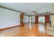 Spacious living room with hardwood floors, fireplace, and large window at 132 S First St, Jamestown, IN 46147