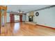Spacious living room featuring hardwood floors, a fireplace, and large window with curtains at 132 S First St, Jamestown, IN 46147