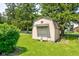 Outdoor storage shed with a red star accent providing ample storage space in a well-maintained yard at 132 S First St, Jamestown, IN 46147