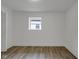 Minimalist bedroom with a window, providing ample natural light and a serene atmosphere at 1411 N Grant Ave, Indianapolis, IN 46201