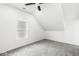Bright bedroom features textured ceilings, a window, and a modern ceiling fan at 1425 N Grant Ave, Indianapolis, IN 46201