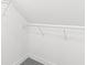 Walk-in closet with hanging shelves for storage at 1425 N Grant Ave, Indianapolis, IN 46201