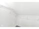 Walk-in closet with hanging shelves for storage at 1425 N Grant Ave, Indianapolis, IN 46201