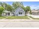 Quaint two-story home with a well-manicured front lawn at 1425 N Grant Ave, Indianapolis, IN 46201