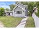 Charming two-story home with a well-manicured front lawn at 1425 N Grant Ave, Indianapolis, IN 46201