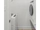 Clean laundry room featuring modern washer and dryer units at 1425 N Grant Ave, Indianapolis, IN 46201