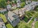 Aerial view of a neighborhood showcasing a well-maintained blue home with a cozy backyard deck and mature trees at 1436 Central Ave, Indianapolis, IN 46202
