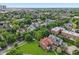 Aerial view capturing a quiet neighborhood, lush trees, and diverse architectural styles at 1436 Central Ave, Indianapolis, IN 46202