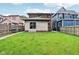 Backyard view showing grassy yard, wooden fence, and house exterior at 1436 Central Ave, Indianapolis, IN 46202