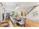 Spacious dining area showcases hardwood floors and a staircase, blending modern and traditional styles at 1436 Central Ave, Indianapolis, IN 46202