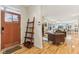 Inviting entryway leads into an open-concept living space with hardwood floors and abundant natural light at 1436 Central Ave, Indianapolis, IN 46202