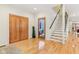 Welcoming entryway with hardwood floors, and staircase leading to the upper level, creates a warm and inviting atmosphere at 1436 Central Ave, Indianapolis, IN 46202