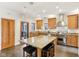Modern kitchen with large island, stainless steel range, and door to patio for easy outdoor access at 1436 Central Ave, Indianapolis, IN 46202