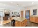 Bright, open kitchen with granite island, stainless appliances, and seamless flow into the living and dining areas at 1436 Central Ave, Indianapolis, IN 46202