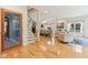 Bright and open-concept living space with hardwood floors, chandelier, and staircase, perfect for modern living at 1436 Central Ave, Indianapolis, IN 46202