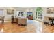 Bright living room boasts large windows, hardwood floors, and comfortable seating at 1436 Central Ave, Indianapolis, IN 46202