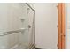 Contemporary shower with glass door, white tiling, and chrome fixtures for a clean and modern look at 1436 Central Ave, Indianapolis, IN 46202