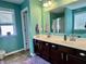 Double sink bathroom featuring vanity and a walk-in shower at 1518 Valdarno Dr, Greenwood, IN 46143