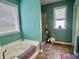 Well-lit bathroom featuring a tub with jets, a walk-in shower, and neutral tones at 1518 Valdarno Dr, Greenwood, IN 46143