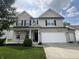 Charming two-story home with brick and siding, black shutters, and a well-maintained lawn at 1518 Valdarno Dr, Greenwood, IN 46143